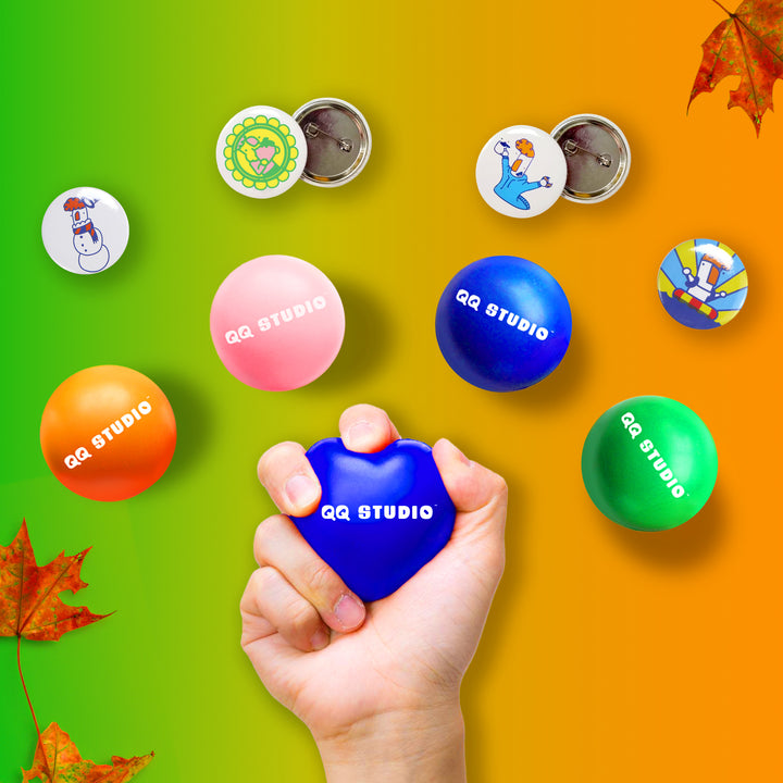 QQ Studio® Gift – Random Color Stress Balls + Reiners Pins