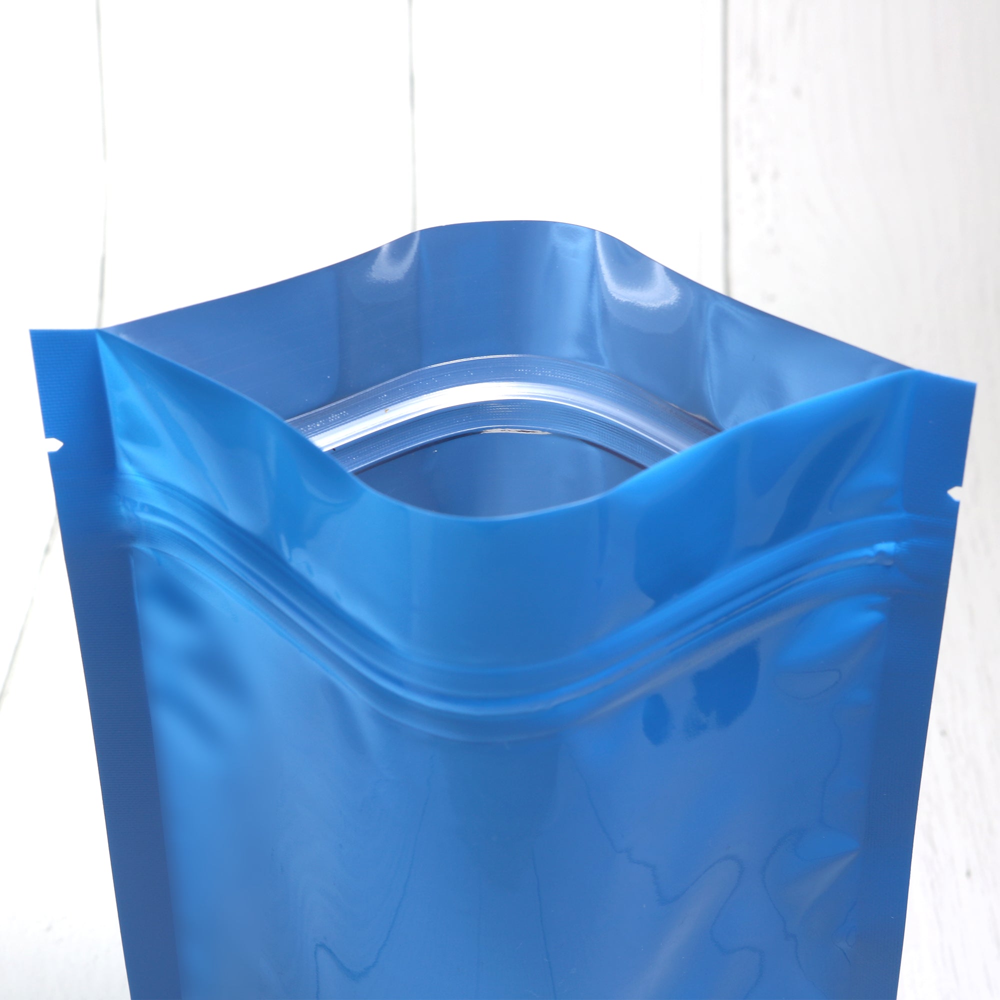 Glossy Wavy Blue Round Window Plastic and Mylar Stand Strong® Bags