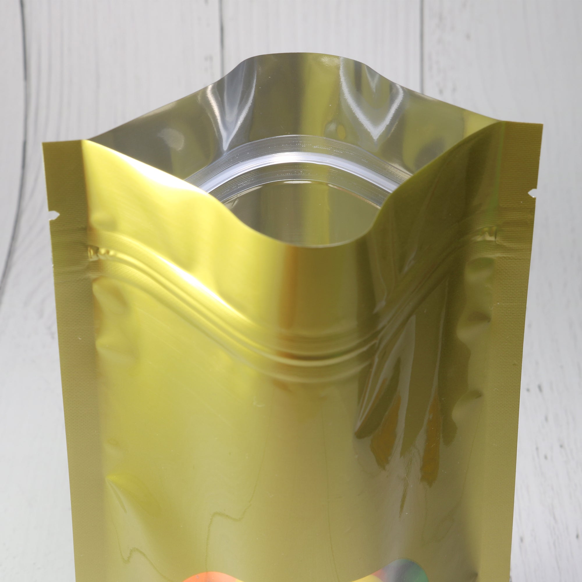 Glossy Sweet Cream Gold Round Window Plastic and Mylar Stand Strong® Bags