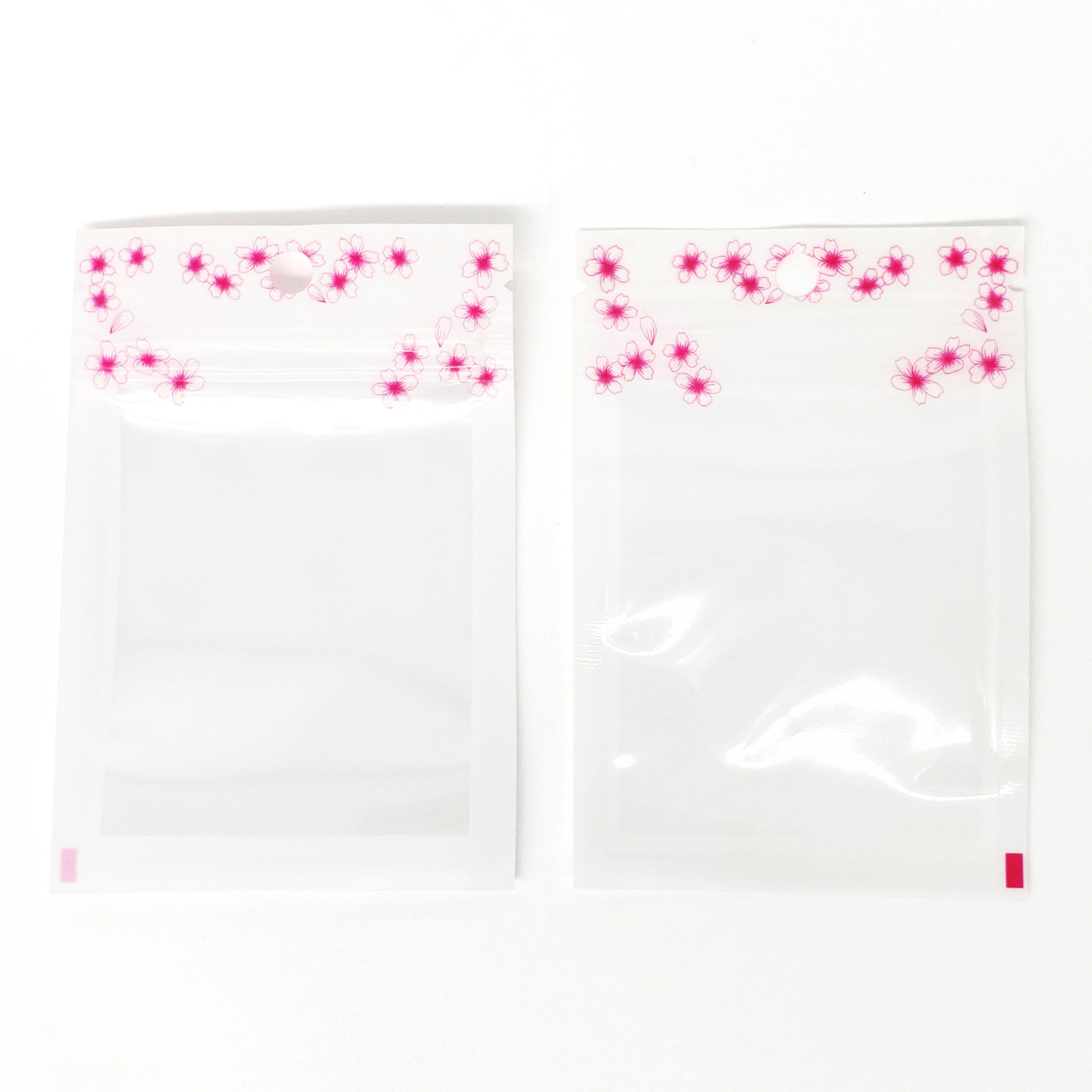 Glossy Floral White Polyethylene Zipper Seal Flat Bags with Flower Border and Hang Hole